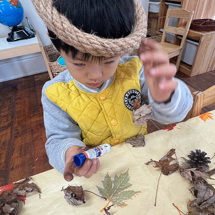 Mini Masterminds Child Care A child with a rope around his head.